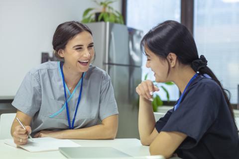 two young nurses laughing