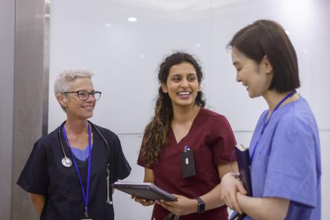 3 nurses talking